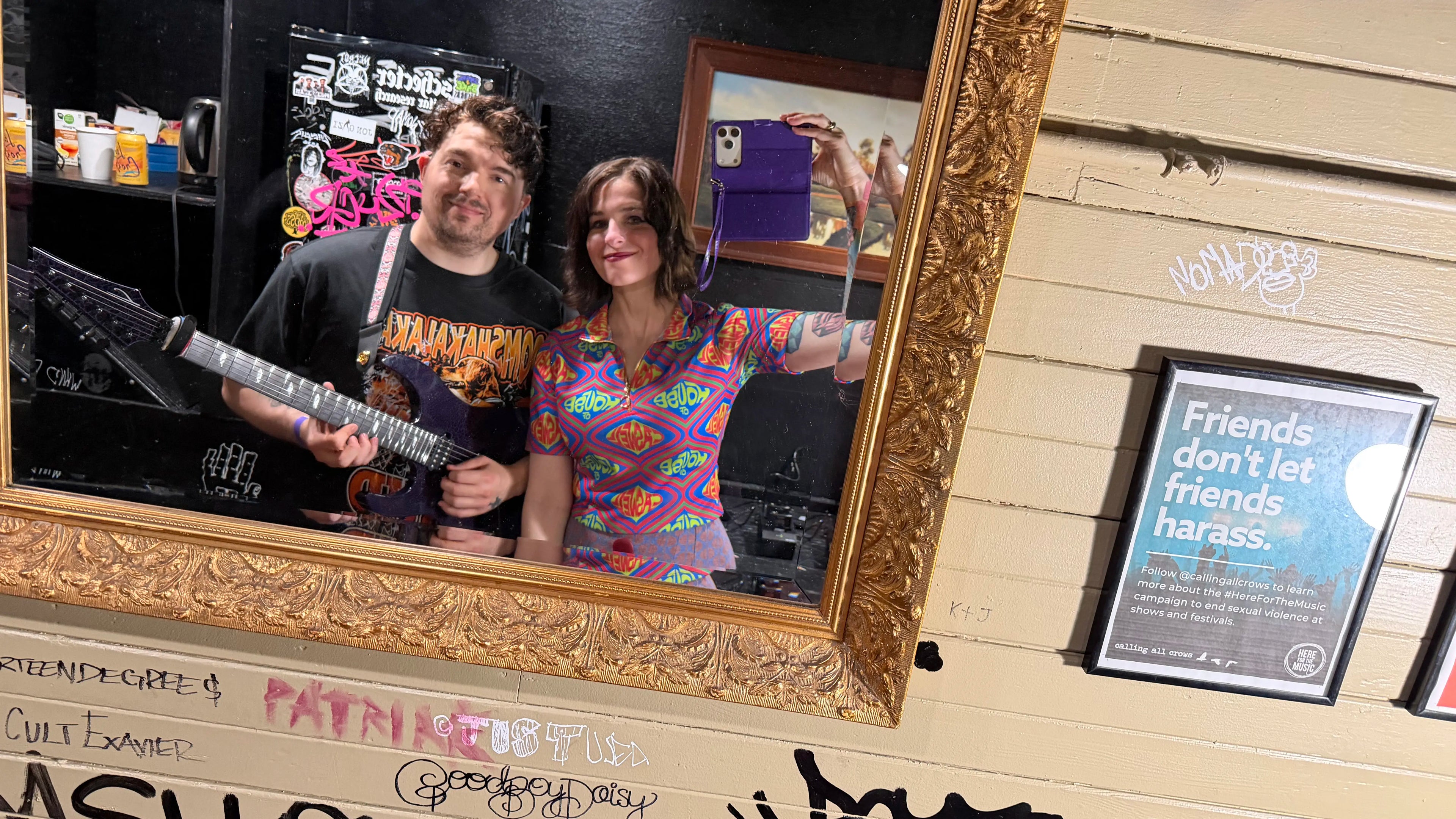 Kaylie and Charlie Caswell pose for a mirror selfie backstage before Berried Alive's first live performance together at the Hawthorne Theatre in Portland, Oregon.